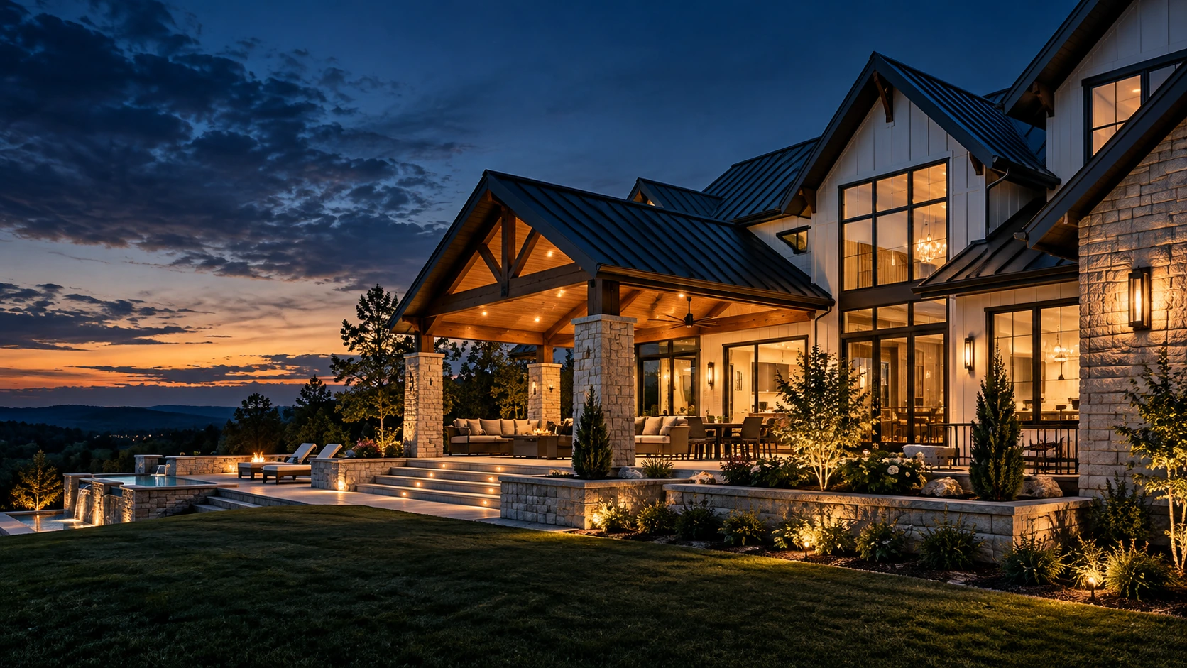 A luxury home with a warmly lit covered patio at dusk